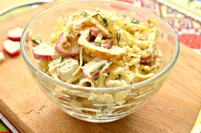Salad with crab sticks, pancakes and cheese
