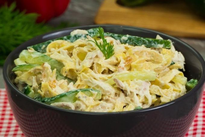 Salad with egg pancakes, cheese and chicken