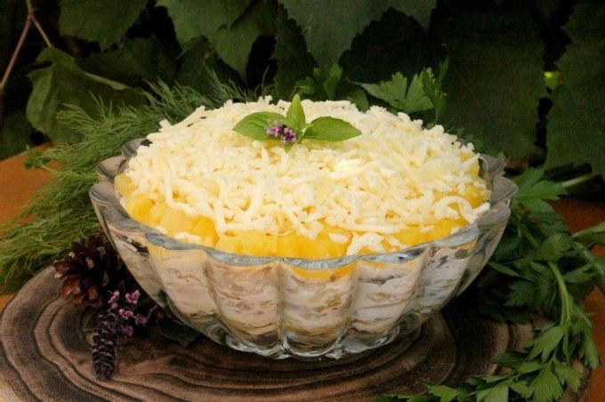 Puff salad with champignons, smoked chicken and pineapple